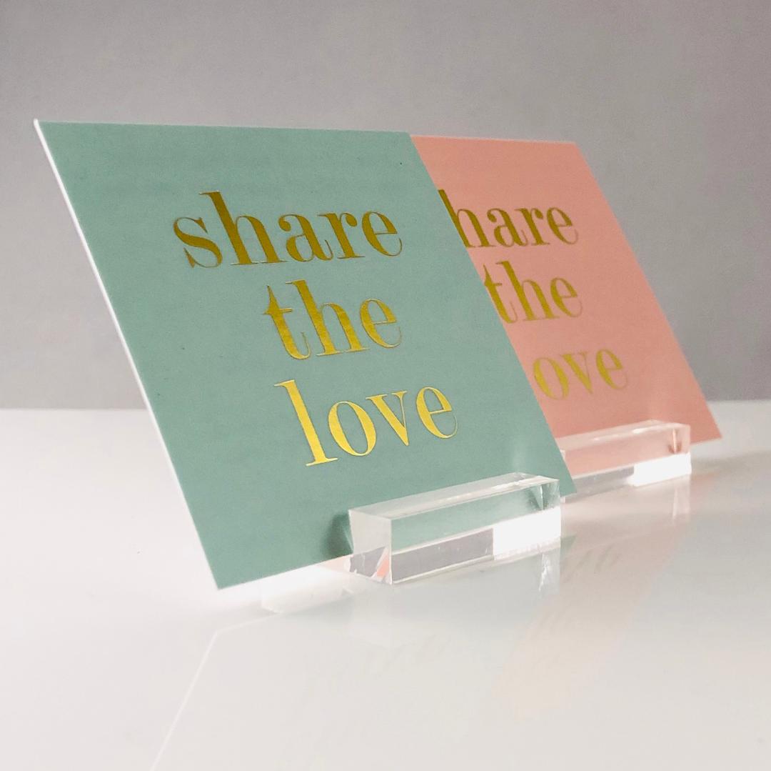 cards sitting in acrylic card display stands