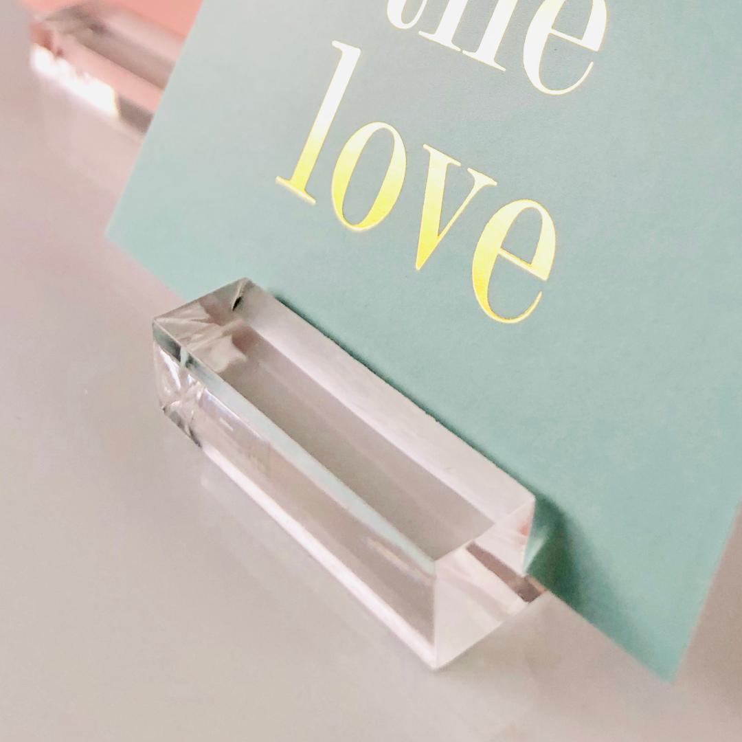 close up of card inserted in acrylic card display stand