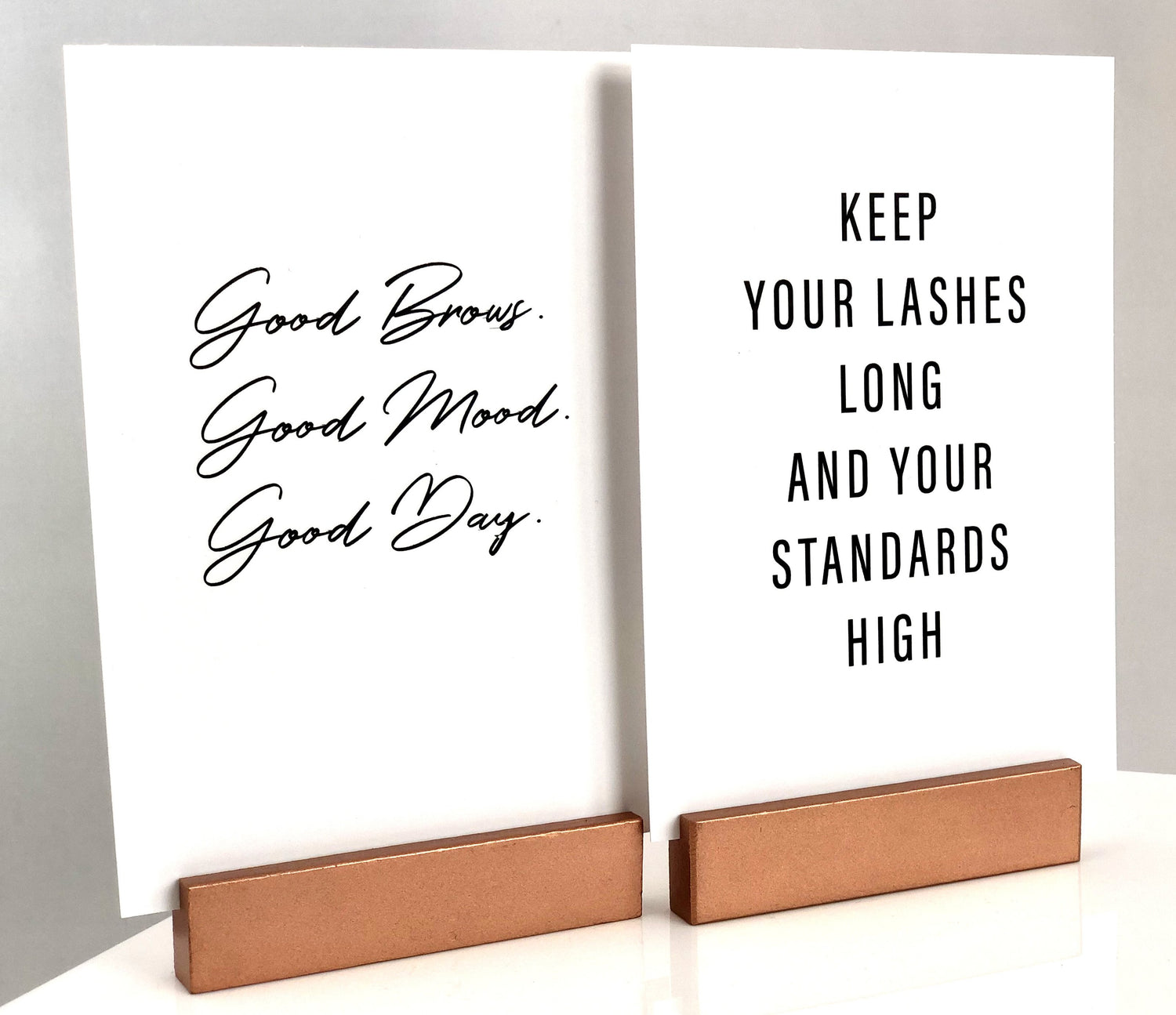 Quote prints standing on easels.