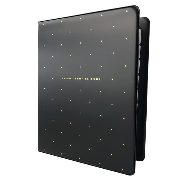 Angled view of black salon client profile book with gold polkadots. Alpha divider tabs peeking out.