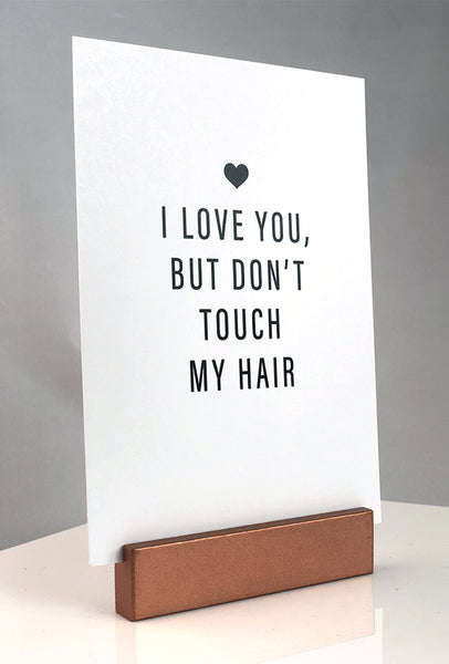 Sign stand with print inserted. I love you, but don't touch my hair.