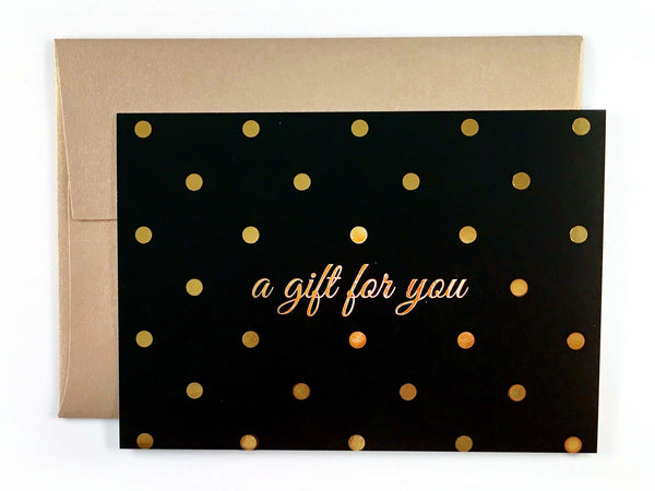 Gold polka dot salon gift certificate with gold envelope