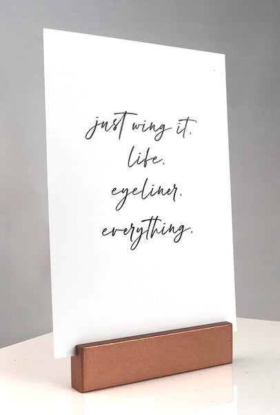 Sign stand with print inserted. just wing it. life. eyeliner. everything.