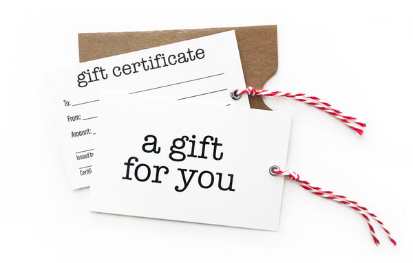 Small salon gift certificate with kraft sleeve and red and white twine